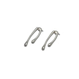 Minimal chic silver droplet earrings in an irregular shape, featuring a modern, artistic design.