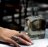 Funky hammered silver-plated metal ring displayed on a finger, showcasing a unique chunky design and adjustable fit.