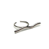 Satin silver adjustable ring with a unique wavy design, showcasing minimalist and edgy styling.
