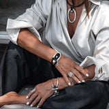Silver-plated stirrup style cuff bracelet with genuine leather buckle clasp, adjustable equestrian statement design