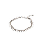 Dainty 999 silver antique plated anklet with small round charms, featuring an adjustable chain for a snug fit.