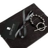 Bracelet with ball chain, leather and ring and bar closure made in the Unode50 style
