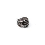 Adjustable silver-plated ring featuring a dark ethnic cone and dotted pattern, suitable for thumb or pinky wear.