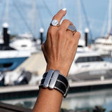 Unisex wide black leather cuff bracelet with silver-plated Zamak bars and chain strands, 30mm statement design