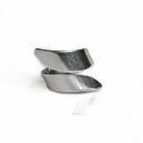 Silver-plated adjustable chunky ring with a unique twisted design, showcasing a glossy finish.