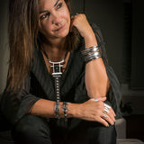 Silver-plated adjustable chunky ring set worn on fingers, featuring a mix of wide cuffs and statement styles.