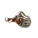Bold snake chains bracelet featuring a neutral woven leather band, with stainless steel accents and engraved logo tag.