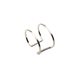 Chunky minimalist metallic open double band cuff bangle with a sleek silver finish, adjustable for comfort.