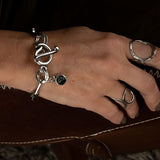 Chic stainless steel bracelet with an oval link chain, featuring a "Silver Night" Swarovski crystal charm and T-bar closure.