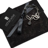 Chic stainless steel bracelet with a silver oval link chain and a "Silver Night" Swarovski crystal charm.