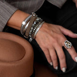 Layered bracelet stack set with suede leather wrap, hematite bead bracelets, pyrite accents, and hammered silver-tone bangle