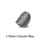 Large oval ethnic calendar ring featuring intricate engravings in dark silver, showcasing a unique boho-chic design.