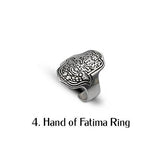 Adjustable silver-toned Hand of Fatima ring with intricate engraving, showcasing a bohemian style and detailed craftsmanship.