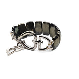 Chunky hematite gemstone cuff bracelet with a gunmetal heart buckle, featuring a bold, edgy design and adjustable size.