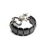Chunky black hematite gemstone cuff bracelet with a silver heart buckle, featuring an adjustable clasp and extension chain.
