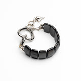 Chunky black hematite gemstone cuff bracelet featuring a gunmetal heart buckle, adjustable size with extension chain.
