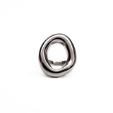Chunky stainless steel ring in a modern donut shape, featuring an irregular design with a polished silver finish.