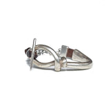 Bold unisex bracelet made with silver-plated Zamak metal and soft brown leather, featuring a unique T-clasp design.