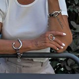 Unisex Bold Arrow and Knot Bracelets featuring silver-plated Zamak metal, soft brown leather, and an adjustable design.