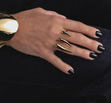 Adjustable double finger horns ring in 18K gold plated stainless steel, featuring a sharp, geometric design.
