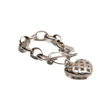 Textured heart charm bracelet in antique-plated 999 silver; features a woven heart pendant on a chunky chain.