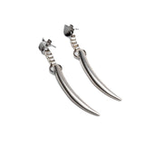 Long, silver-plated spike earrings featuring a sleek, tooth-like design; unique and edgy with a dangling style.