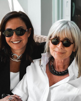 Chunky Sculptural Collar Necklace with oversized loops worn by two women, one in a black blazer and the other in a white shirt.