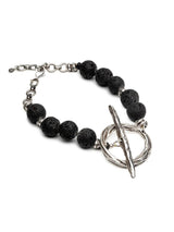 Chunky lava stone choker necklace featuring black volcanic rock beads and a bold oversized T-clasp toggle.