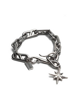 Silver chain bracelet with a star charm on a white background