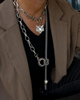 Choker and long necklace set featuring antique plated steel with a tiger head pendant, worn layered over a black top.