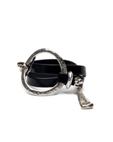 Bold wrap leather & metal statement cuff bracelet featuring multi-strand black leather and a textured silver-plated metal ring.