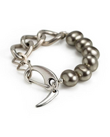 Silver bracelet with heart charm and pearl beads on a white background