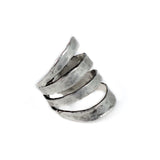 Funky hammered silver-plated metal ring with adjustable spiral design, showcasing an edgy and unique style.