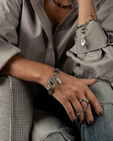 Sterling silver plated two-finger ring features a geometric design, slightly adjustable to fit sizes US 6 and 7.
