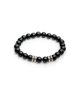 Black beaded bracelet with silver accents on a white background