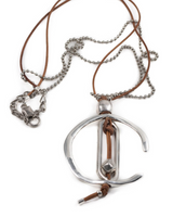 Necklace with a silver pendant featuring a design on a white background