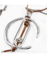 Silver necklace with leather cord on a white background