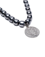 Layered necklace set featuring dark semi-precious stone beads and a silver pendant with an eagle motif.