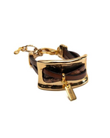 Gold and brown bracelet on a white background