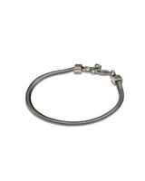 Silver snake chain anklet featuring a sleek design and electro rhodium plated brass, with a secure clasp closure.