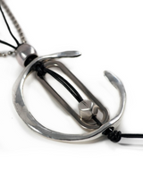 Metallic pendant with a hook design on a white background