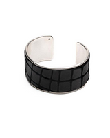 Black and silver cuff bracelet on a white background