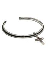 A silver-toned metal snake-style bracelet with a dangling textured cross charm, shown on a plain white background.
