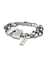 Silver bracelet with charms on a white background