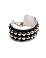 Silver and black beaded cuff bracelet on a white background