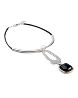 Chunky black resin necklace with a silver-plated metal tube and leather strands, featuring a bold black pendant.