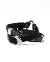 Black leather bracelet with silver hardware on a white background