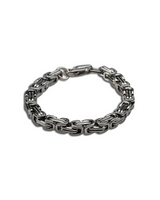 Silver chain bracelet on a white background