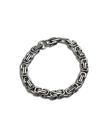 Silver chain bracelet on a white background