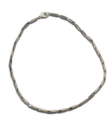 Silver chain necklace on a white background